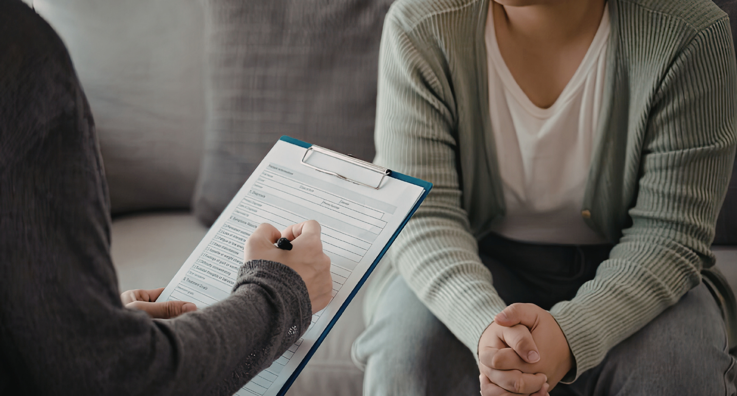 Someone filling out a form with a woman
